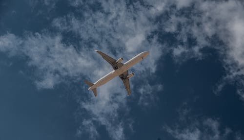 Airplane Flying under Cloud