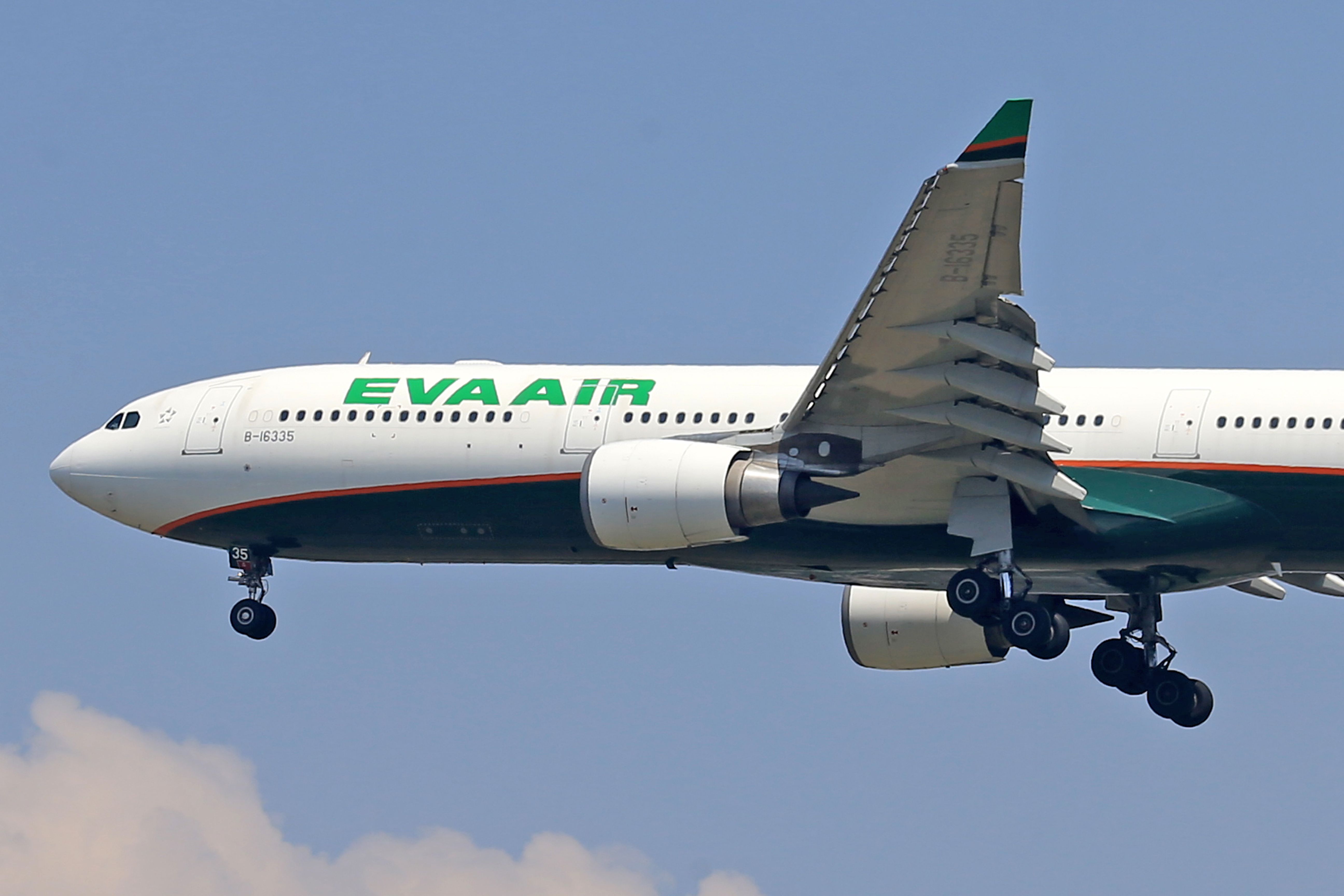 EVA Air Airbus A330 flying under a blue sky, highlighting travel and aviation.