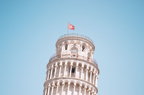 Free Part of the famous Leaning Tower of Pisa against a clear blue sky in Italy. Stock Photo