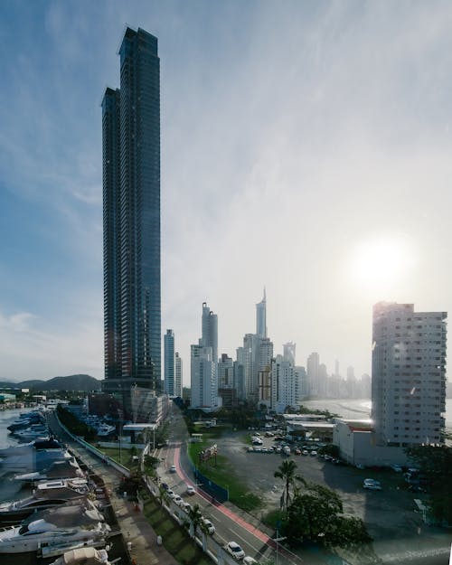 A view of a city with tall buildings and water