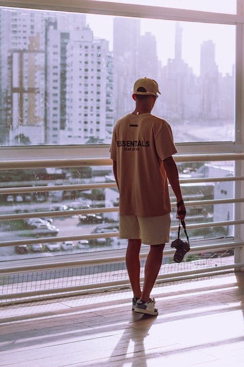 City Buildings behind Man with Camera