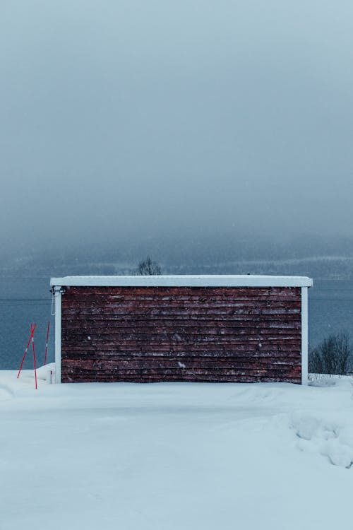 Snow-covered Wooden Shed