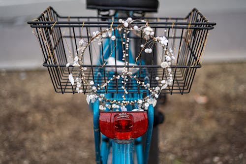 A blue bicycle with a basket on the back