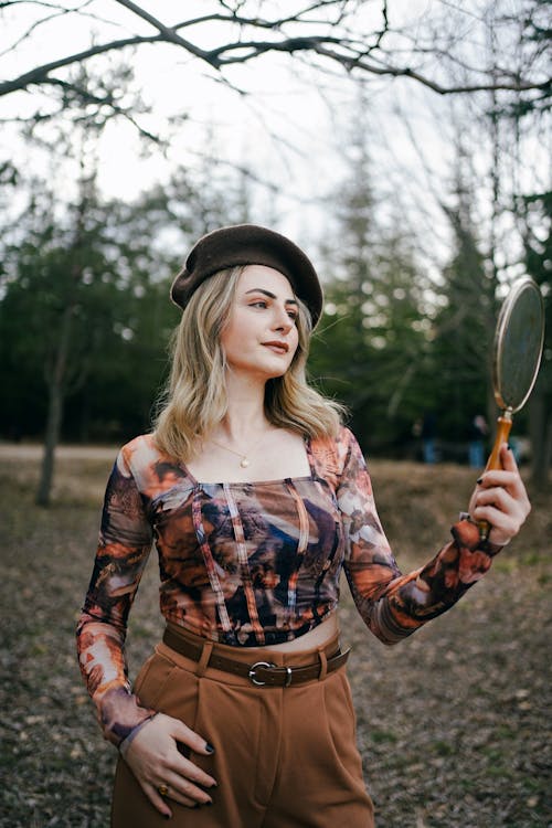 Blonde Woman in Beret and with Mirror