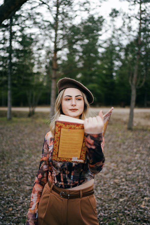 Blonde Woman in Beret Reading Book