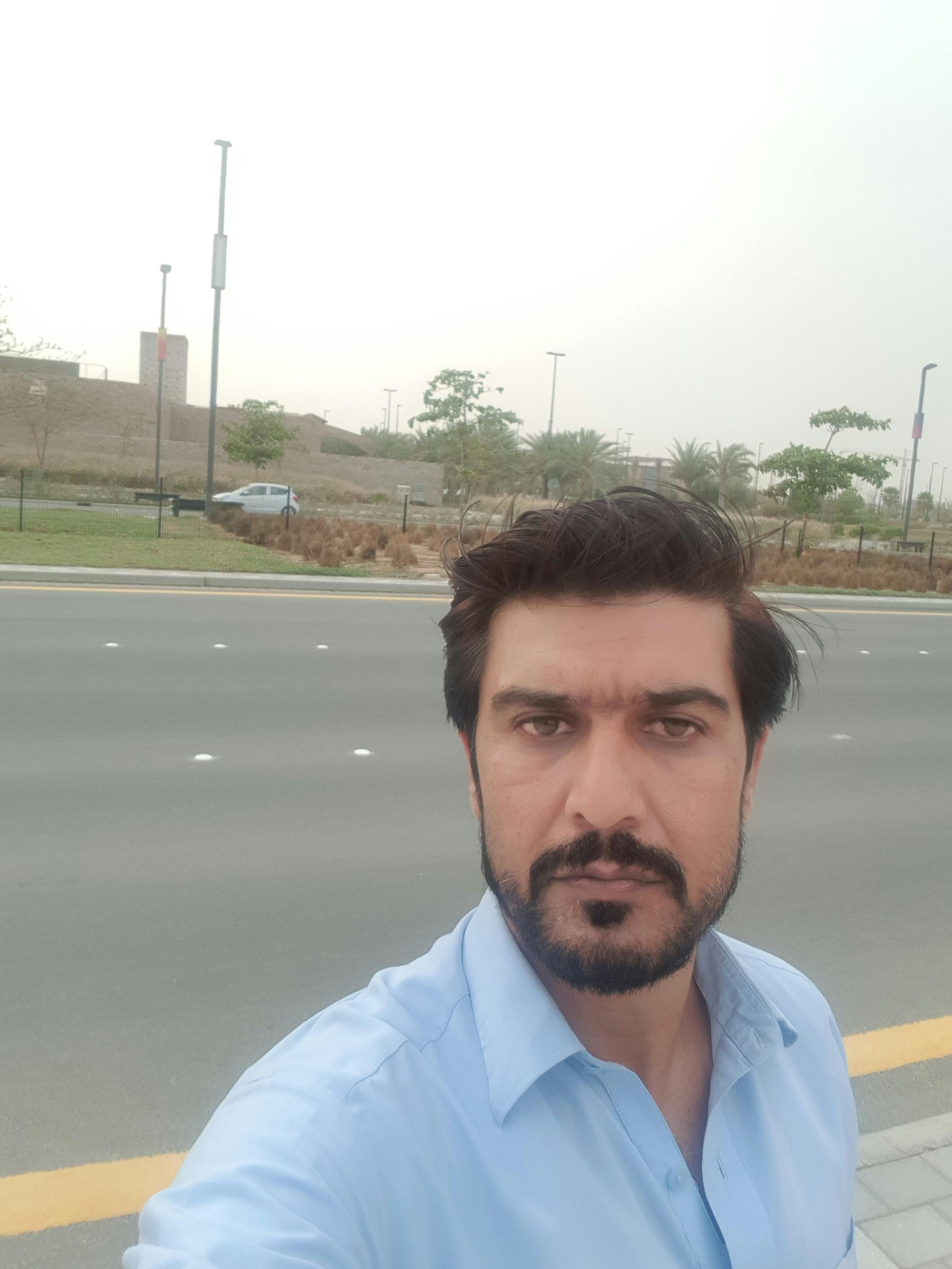 Jar of overnight oats with fruit on a wooden table
