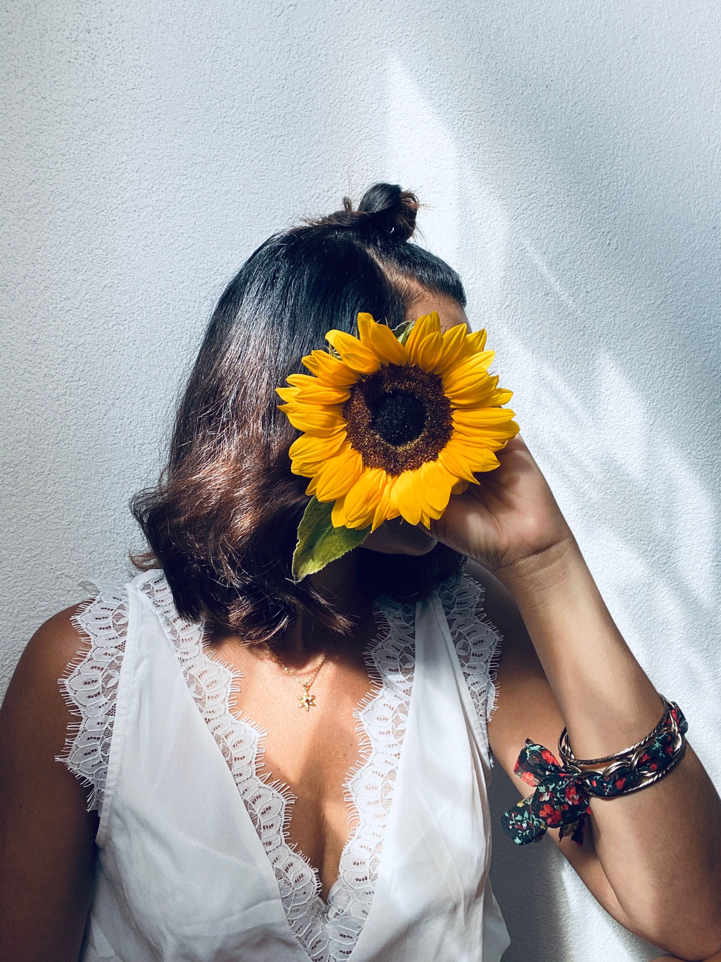 Portrait of Woman Holding Sunflower · Free Stock Photo