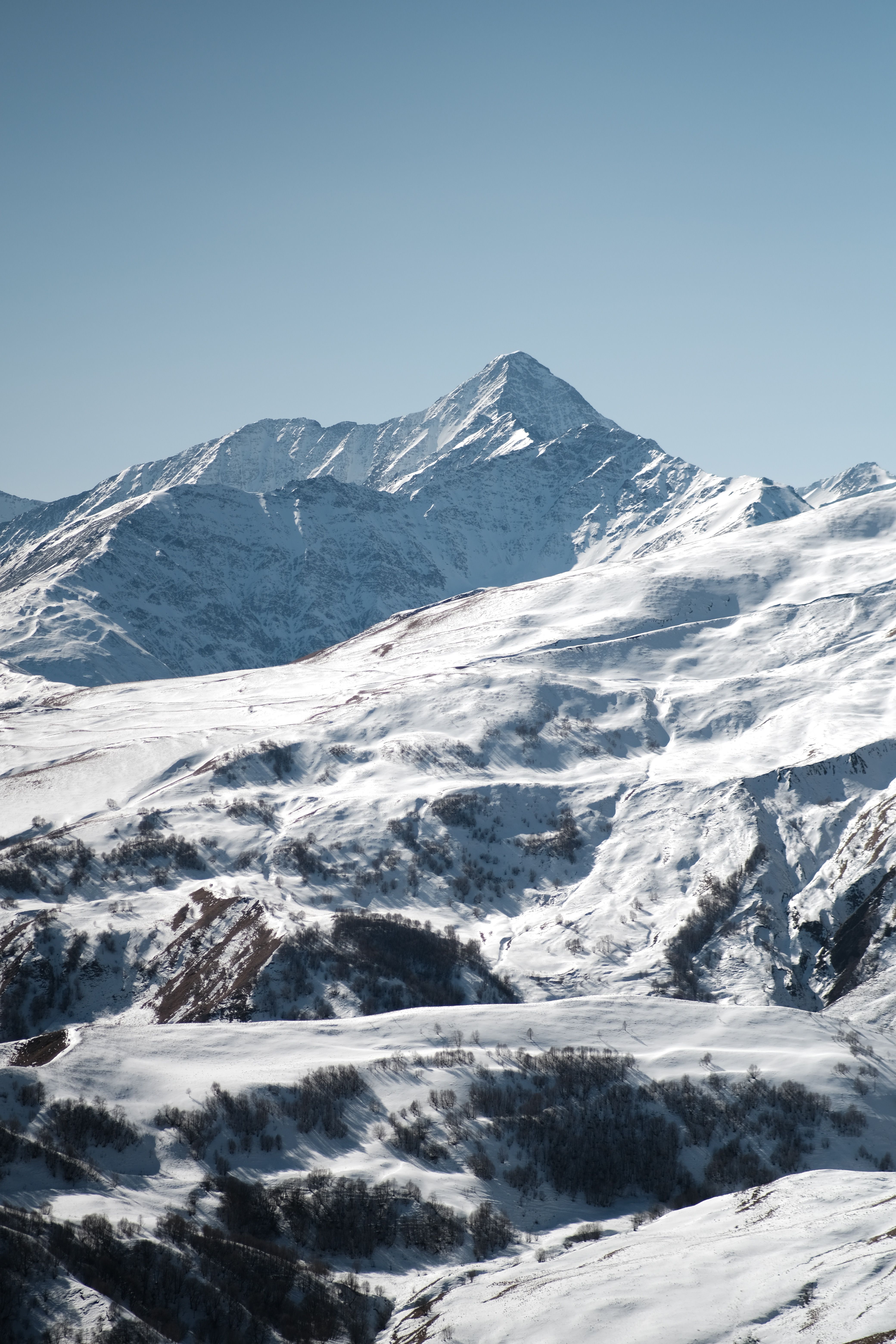 View of Rocky, Snowy Mountains under Clear, Blue Sky · Free Stock Photo