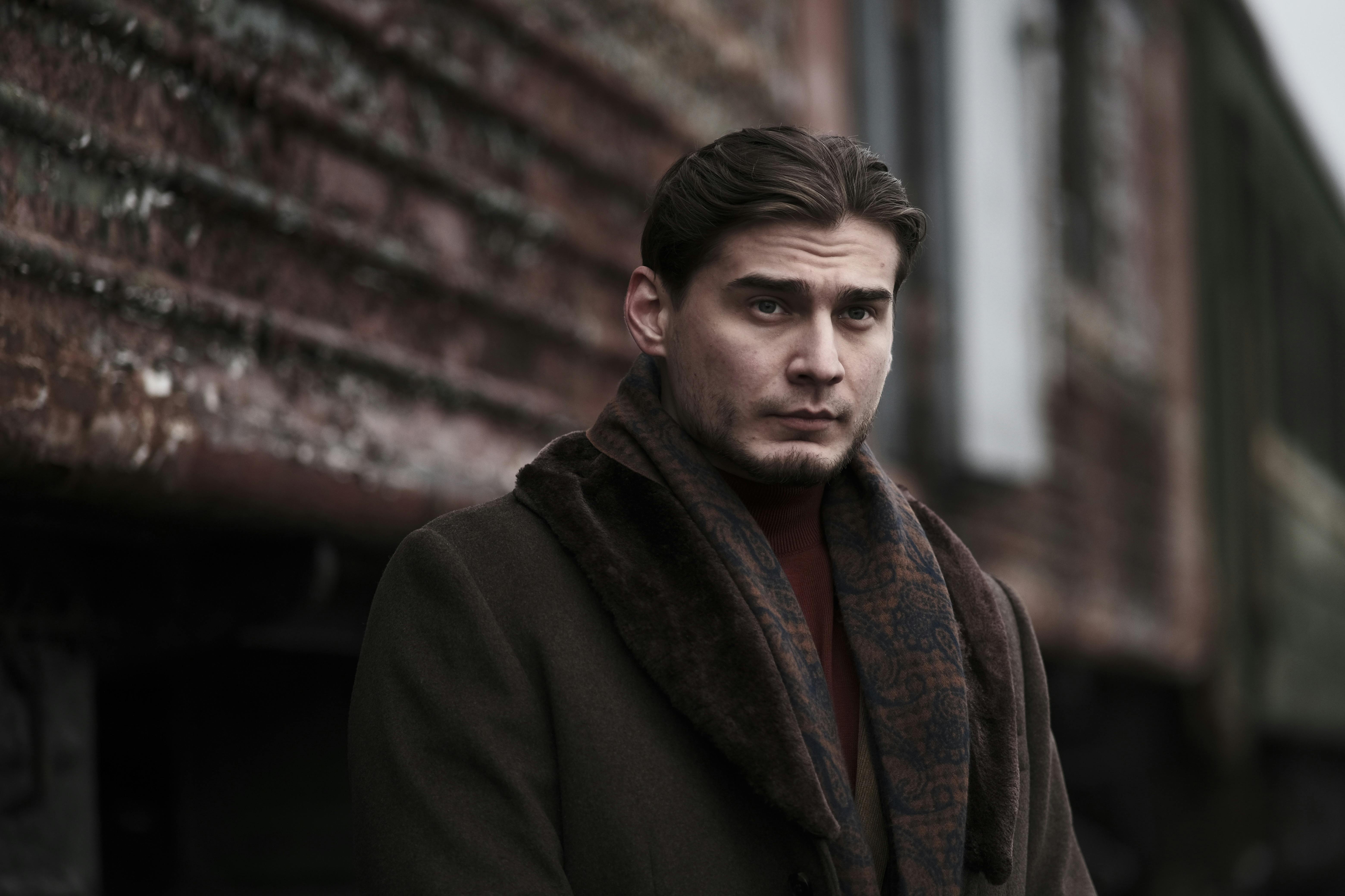Portrait of Man Wearing Brown Coat on a Street
