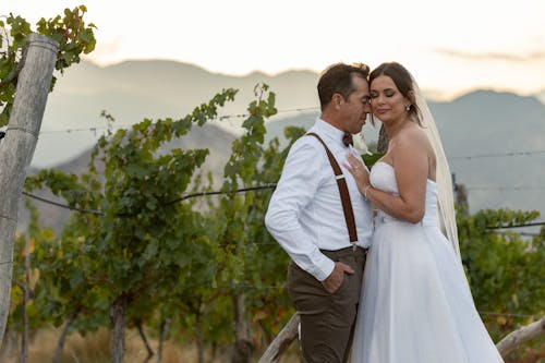 Bride and Groom Embracing in Vineyard
