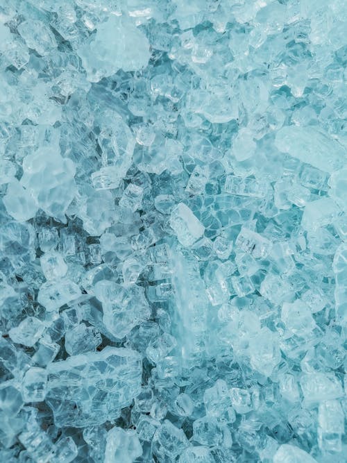 A close up of blue ice with small pieces of ice