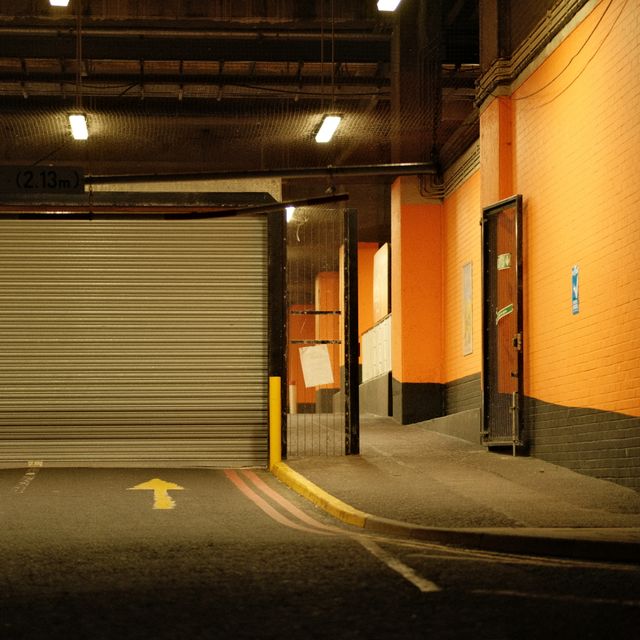 Dim interior corridor at night, photo by Namzy on Pexels