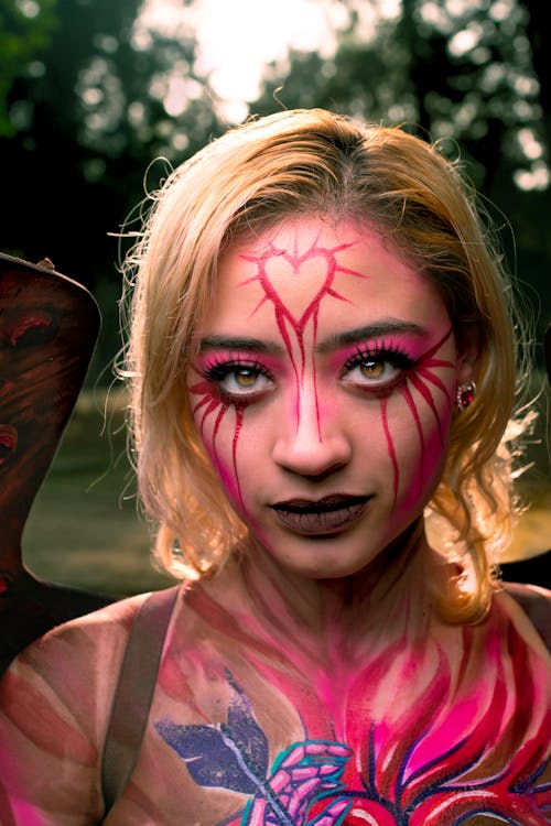 A woman with painted face and body paint