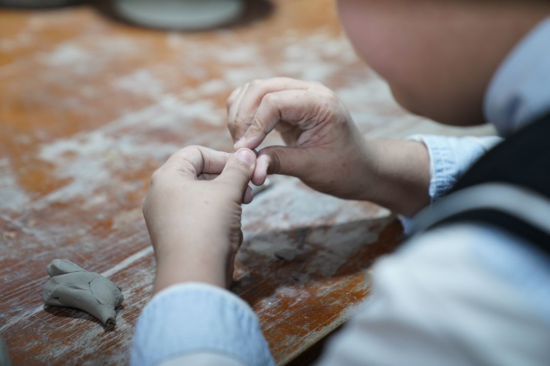 Person Using Clay Close-up of a Person Using Clay · Free Stock Photo