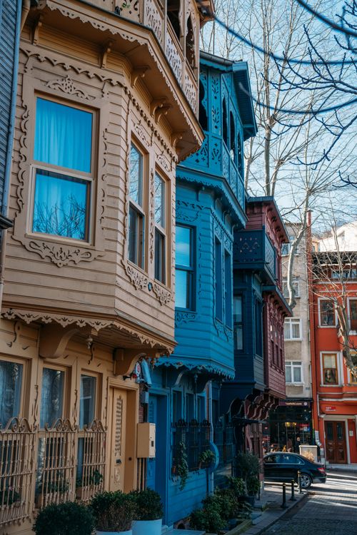 Free Charming colorful historic houses line a street in Istanbul, showcasing ornate architectural details. Stock Photo