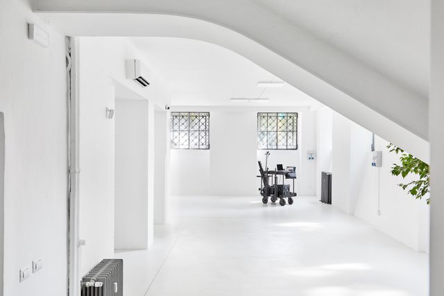 Still frame from the launch film — a bright white studio floor. Photo by The Juggle Studio on Pexels