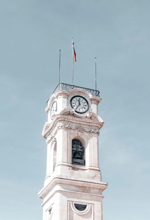 Free Close-up of the iconic clock tower at the University of Coimbra, Portugal. Stock Photo