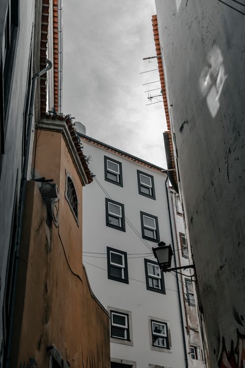 Free Explore traditional Portuguese architecture with charming facades in Coimbra's residential district. Stock Photo