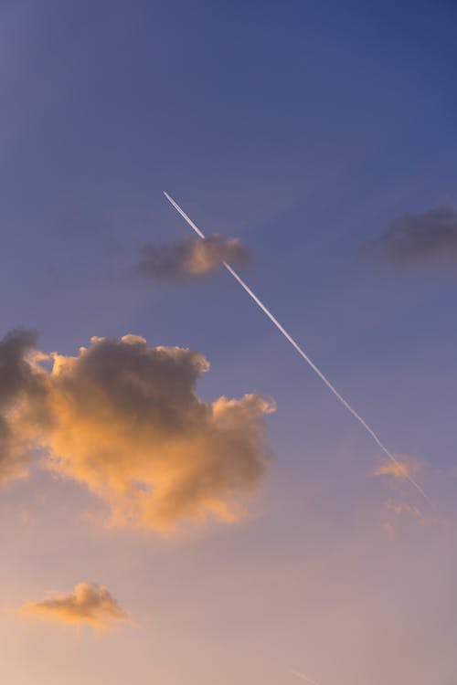 Trail of Airplane in Sky at Dusk