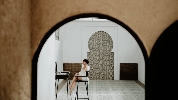 A serene bride prepares for her wedding day in a contemporary styled hall.