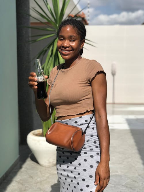 Smiling Woman with Bottle of Coca Cola