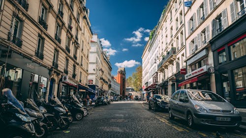 Photo of Motorcycles and Vehicles Parked on Road