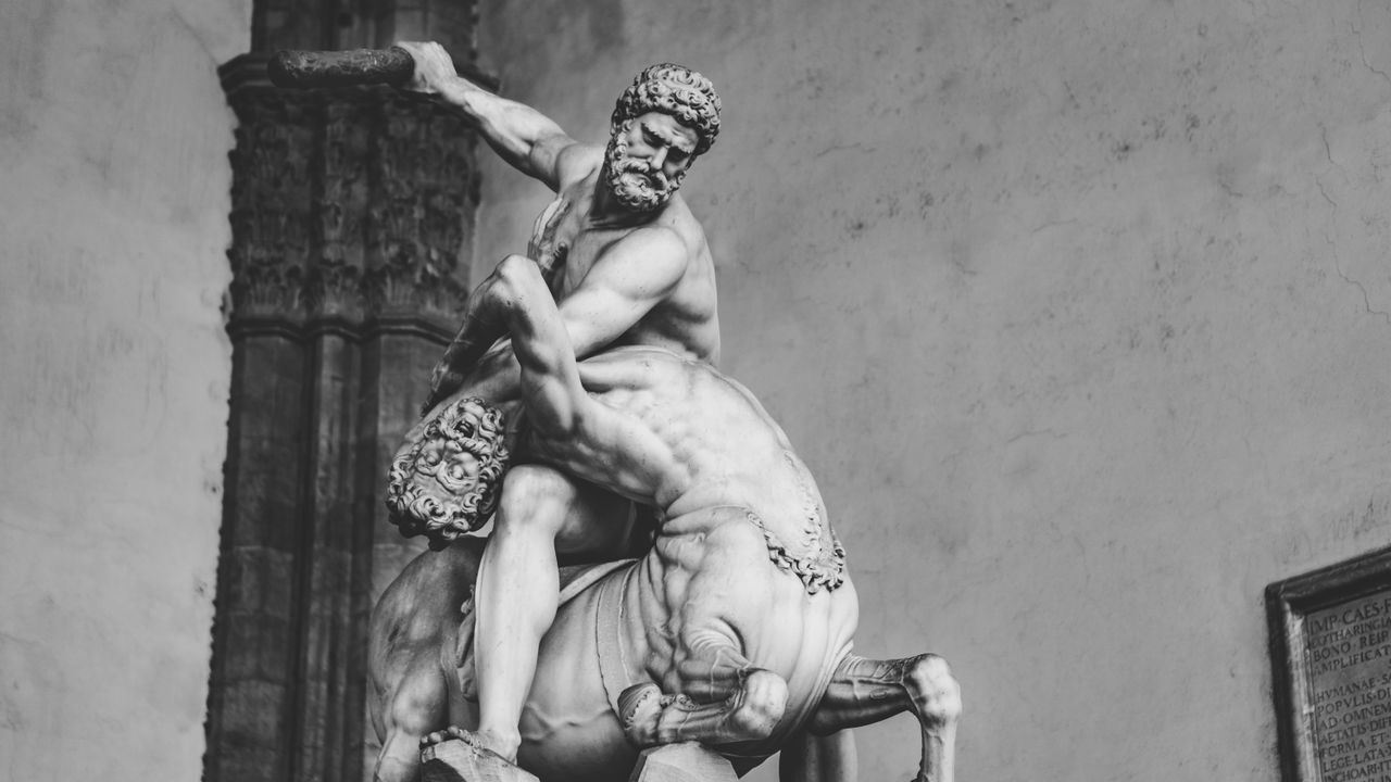 black and white photo of a detailed marble sculpture of hercules fight