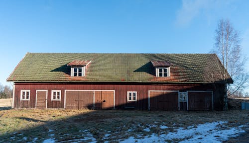 View of a Wooden Barn in the Countryside 