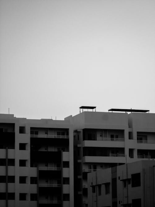 Black and White Photo of Apartment Buildings in City 
