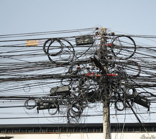 Tangled Power Lines on Utility Pole