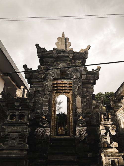 A temple with a gate and a sign that says temple