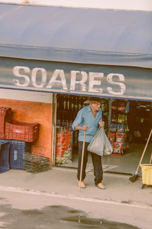 Free Elderly Man Walking on a Street  Stock Photo