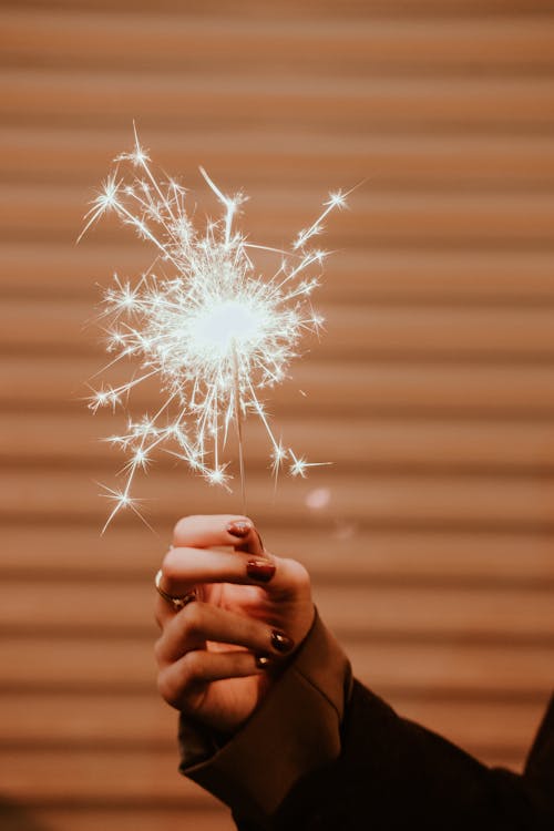 Close-up of a Woman Holding a Sparkler 