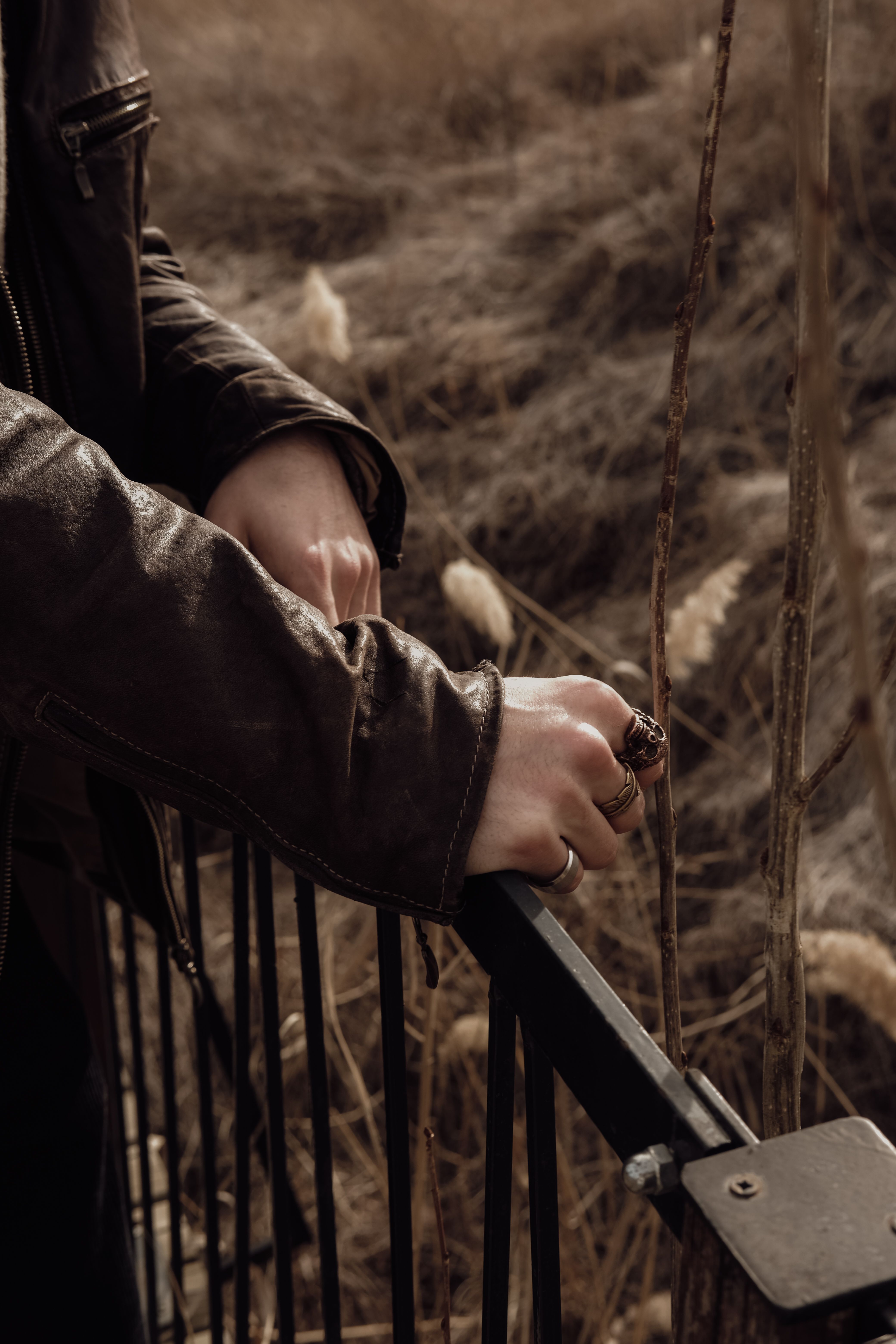 Close-up of a Man Touching the Railing with His Hands · Free Stock Photo