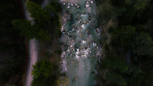 Free A scenic aerial perspective showing a forest stream cutting through trees in Kreuth, Germany. Stock Photo