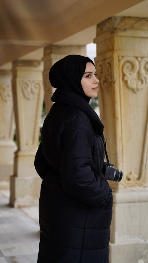 Woman in Black Coat and Hijab