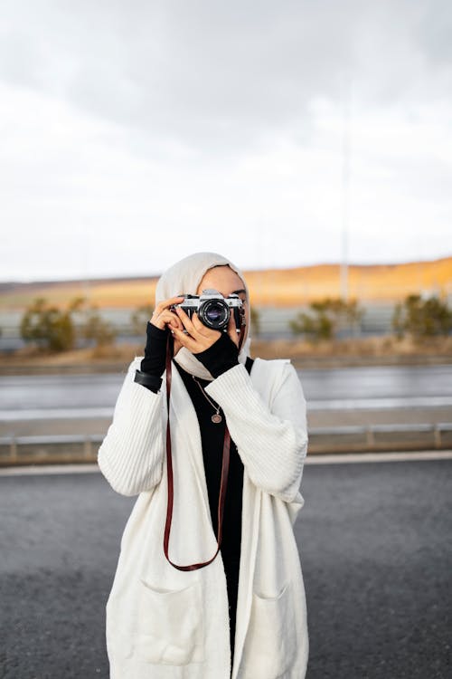 A woman taking a picture with her camera