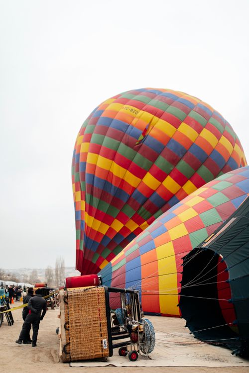 Free Vibrant hot air balloons being prepared for flight in Cappadocia, Turkey. Stock Photo