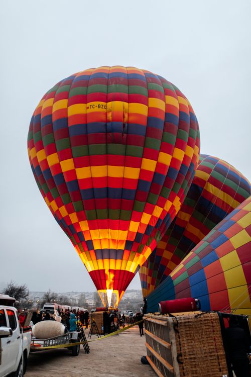 Free Colorful hot air balloons ready for flight in Cappadocia, Turkey, offering a scenic travel experience. Stock Photo