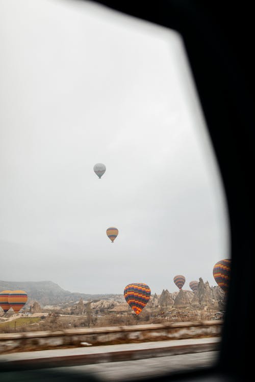 Hot air balloons flying over the city of cappadocia