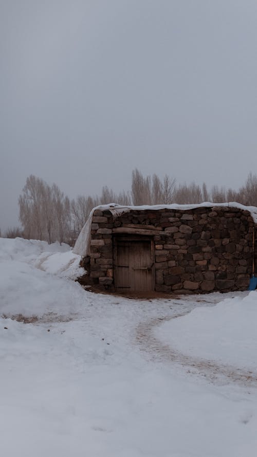 Stone Shed in Snow in Winter