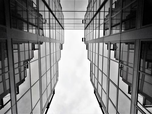 Free Black and white perspective of skyscraper glass facades with reflections. Stock Photo