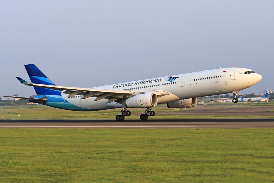 Garuda Indonesia Airbus lifting off from the runway, capturing the excitement of air travel.