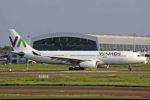 Wamos Air Airbus A330 in side view on airport runway, ready for takeoff.