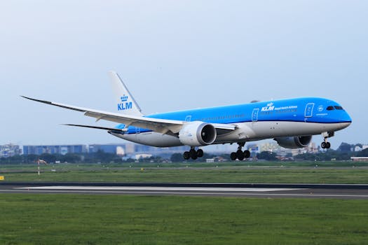 KLM Royal Dutch Airlines Boeing 787 Dreamliner landing on runway.