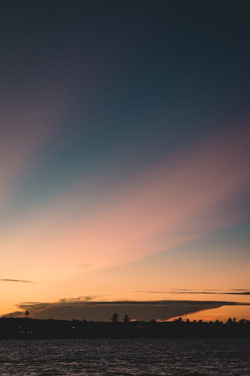 オレンジ色の空, ビーチの夕日, ラグーンの無料の写真素材