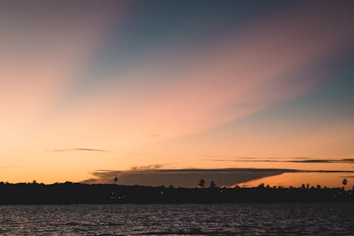 オレンジ色の空, ビーチの夕日, ラグーンの無料の写真素材