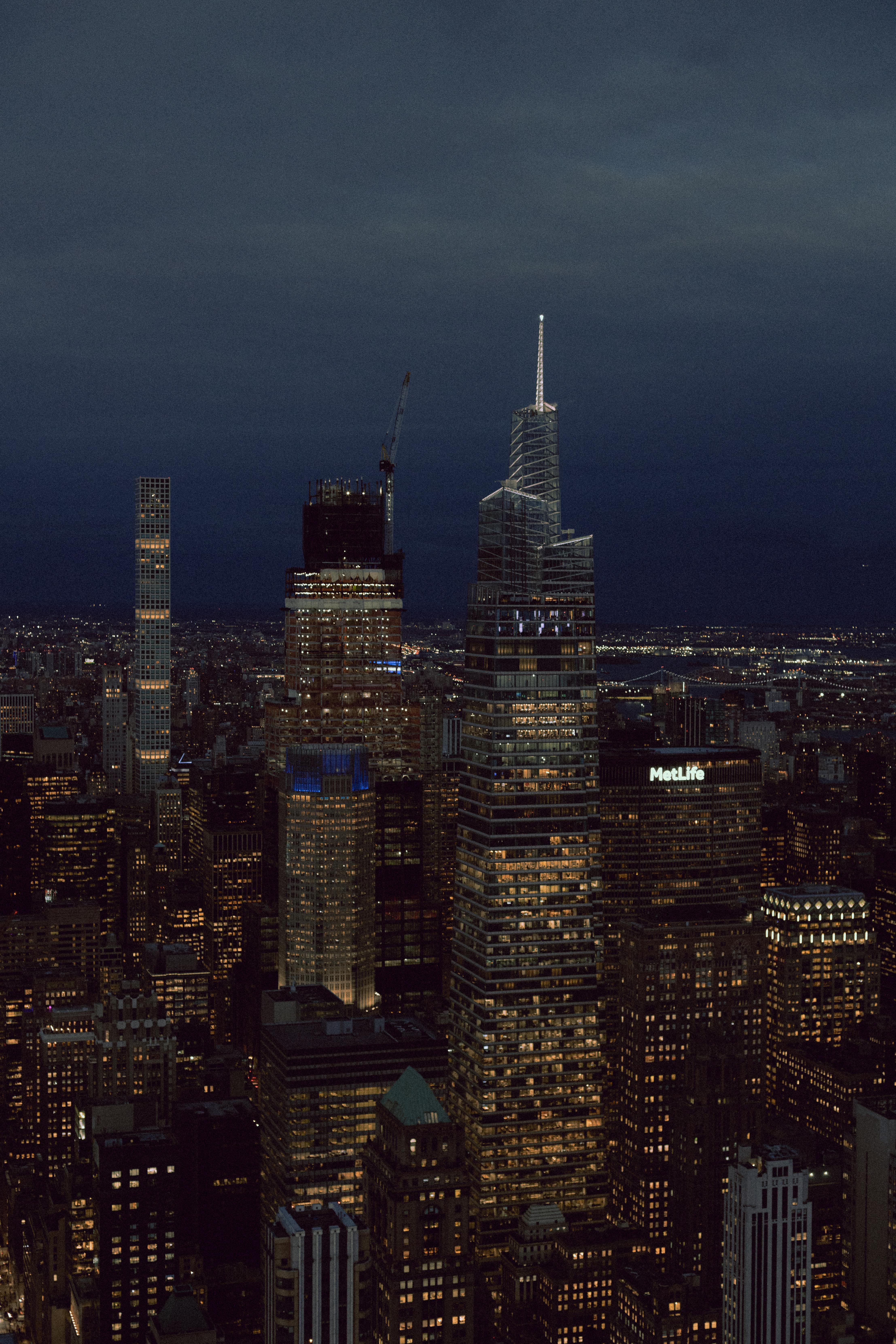 Stunning aerial shot of New York City's illuminated skyline featuring iconic skyscrapers at night.