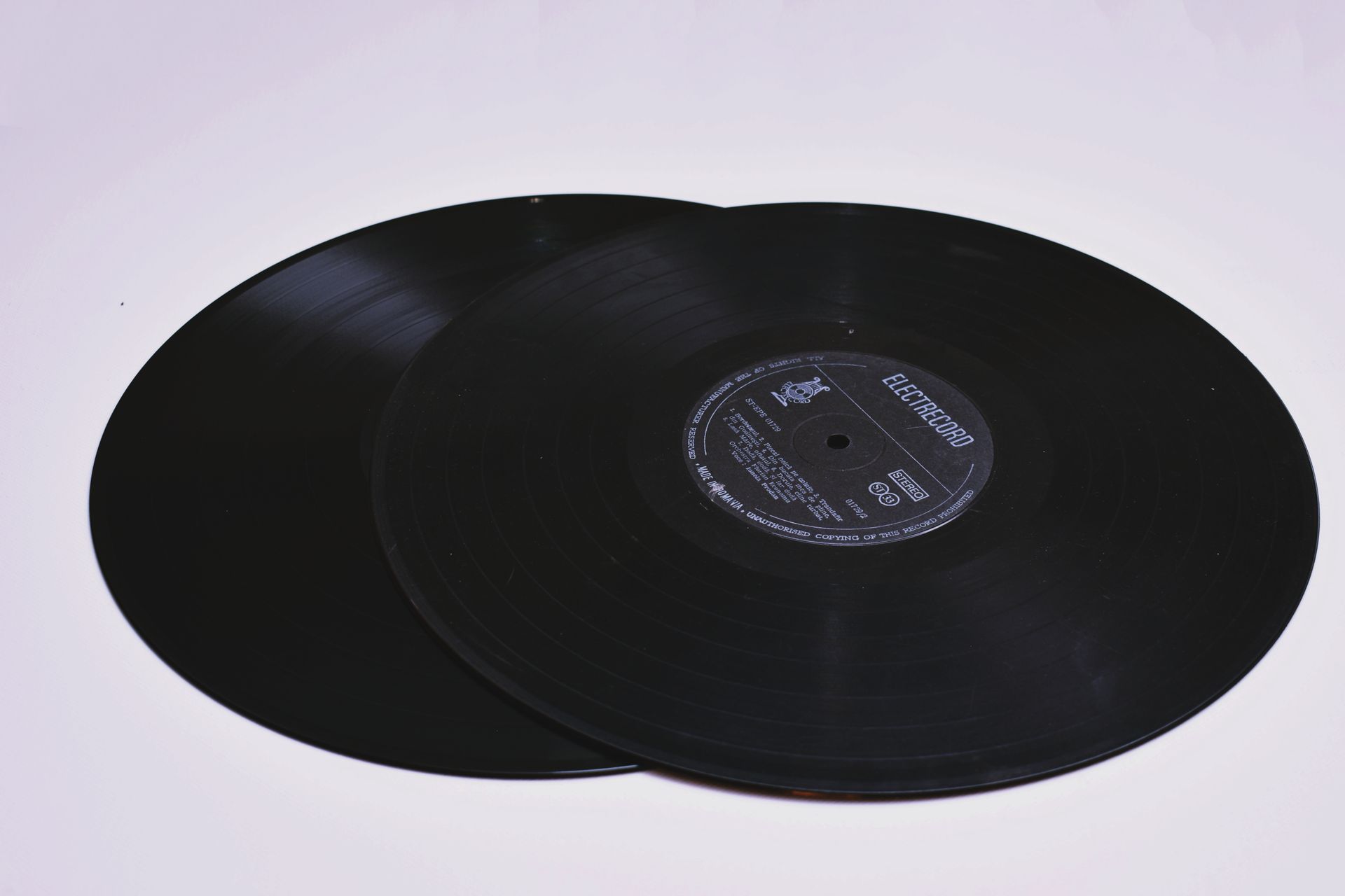 Close-up Photo of Two Black Lp Vinyl Discs