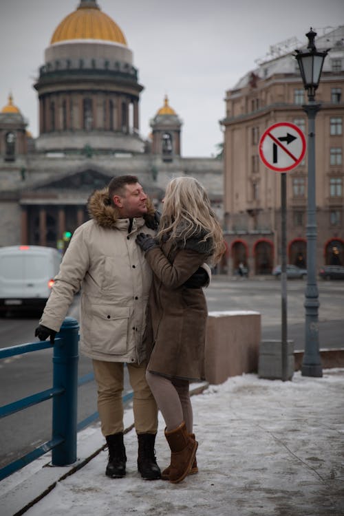 Couple Standing and Hugging on Sidewalk in Saint Petersburg